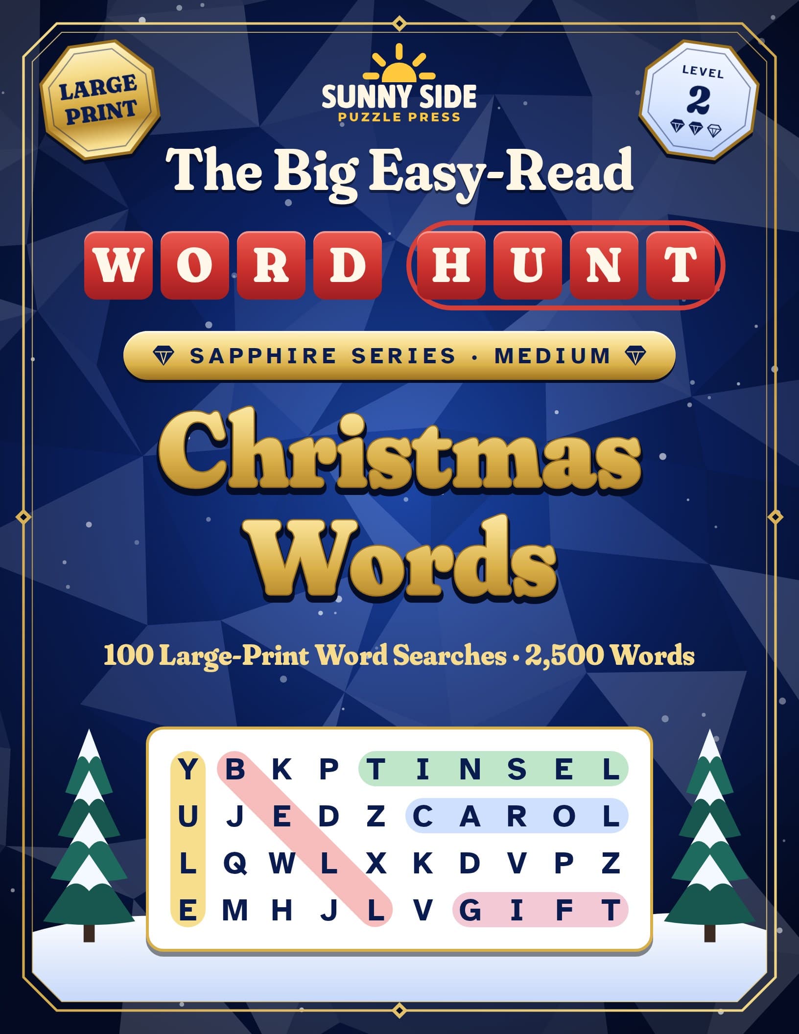 Cover of The Big Easy-Read Word Hunt: Christmas Words, with gold lettering on a deep blue cover inside a gem-cut frame, red Word Hunt letter tiles, a Large Print badge, a Level 2 badge, a Sapphire Series · Medium ribbon, the line 100 Large-Print Word Searches · 2,500 Words, and a sample grid between two snowy pine trees where YULE runs down, BELL slants down, and TINSEL, CAROL and GIFT run across